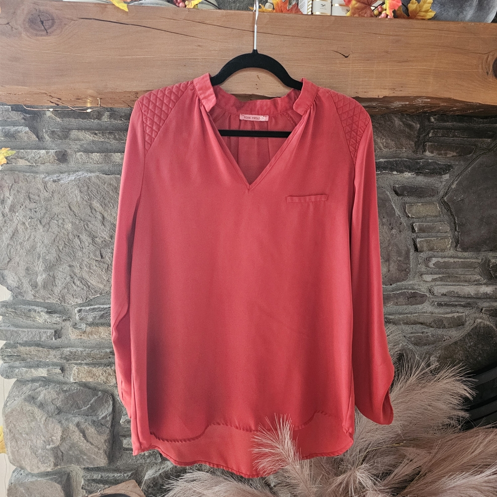 Chic Rust V-Neck Blouse with Quilted Shoulders